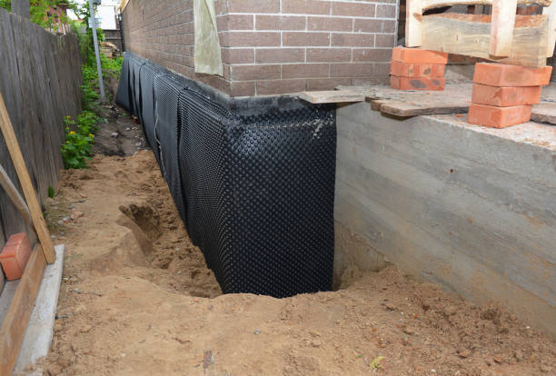 Happy homeowners after waterproofing job in Dansville